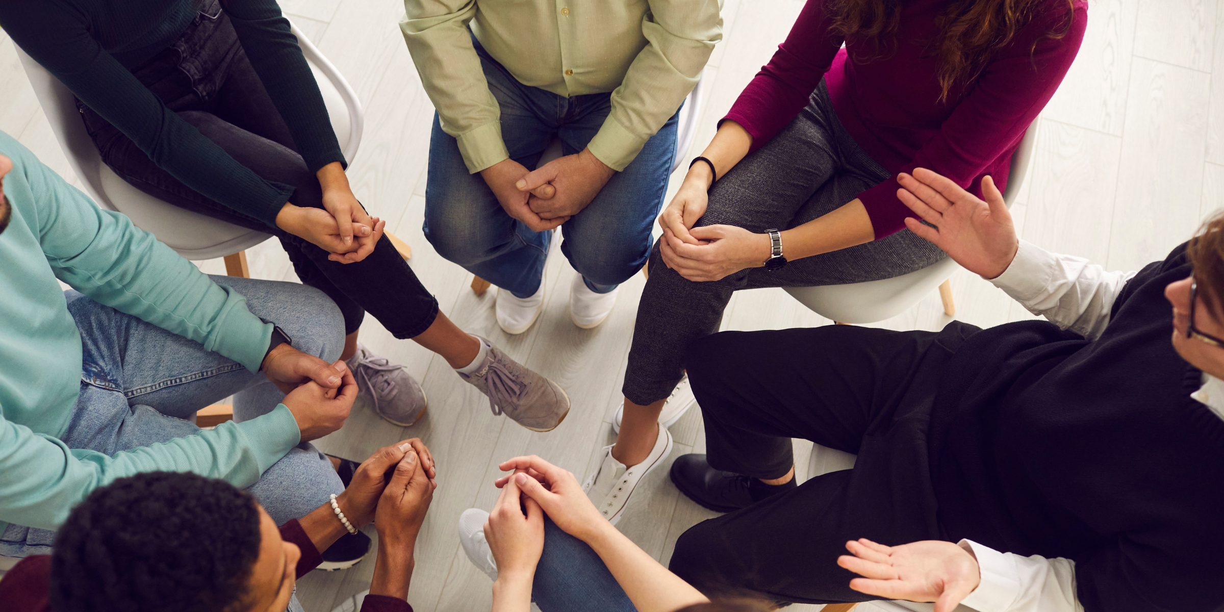 A group of patients sitting in a circle, pictured from above, for an article about how to attract patients to your practice.