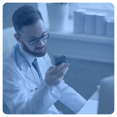 Physician using smartphone with a secure messaging platform texting another physician