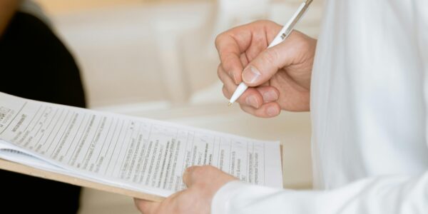 Patient intake form being filled out by doctor